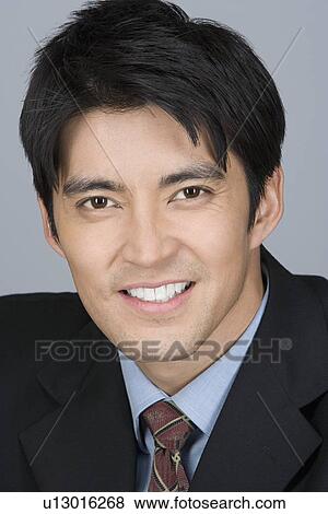 Portrait of happy young businessman View Large Photo Image Stock Photo - Portrait of happy young businessman. Fotosearch