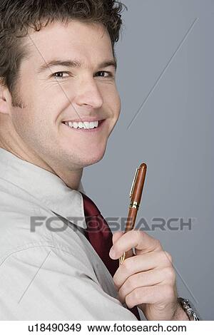 Portrait of happy young businessman View Large Photo Image Stock Photo - Portrait of happy young businessman. Fotosearch