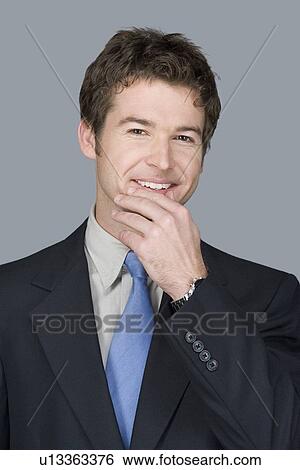 Portrait of happy young businessman View Large Photo Image Stock Photograph - Portrait of happy young businessman. Fotosearch