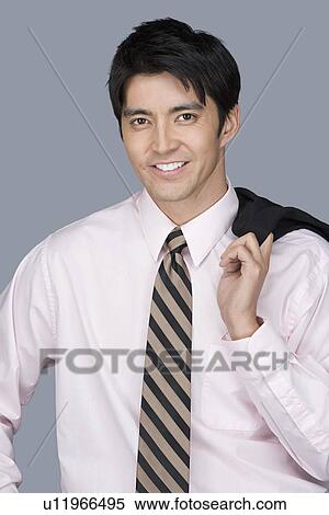 Stock Photography - Portrait of happy young businessman. Fotosearch