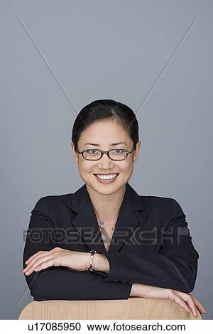 Stock Image - Portrait of happy young businesswoman. Fotosearch