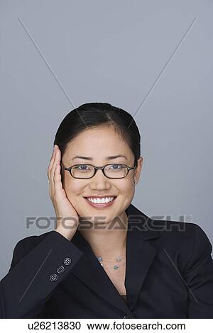 Stock Image - Portrait of happy young businesswoman. Fotosearch
