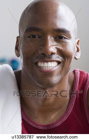 Portrait of male athlete smiling View Large Photo Image Stock Photo - Portrait of male athlete smiling. Fotosearch