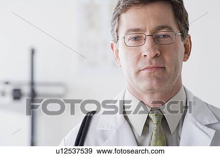 Portrait of male doctor View Large Photo Image Stock Photo - Portrait of male doctor. Fotosearch