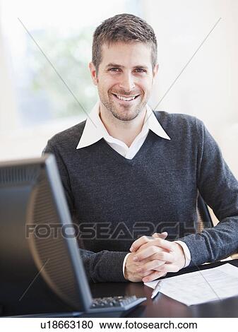 Stock Image - Portrait of man in office. Fotosearch