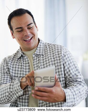 Portrait of man with digital tablet View Large Photo Image Stock Photo - Portrait of man with digital tablet. Fotosearch