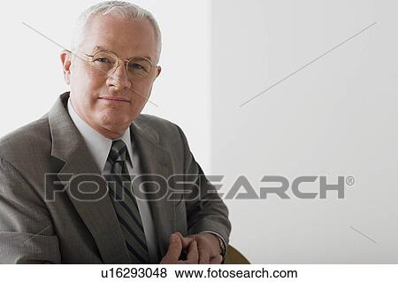 Portrait of mature businessman contemplating View Large Photo Image Stock Photo - Portrait of mature businessman contemplating. Fotosearch