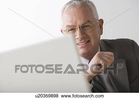 Stock Photo - Portrait of mature businessman. Fotosearch