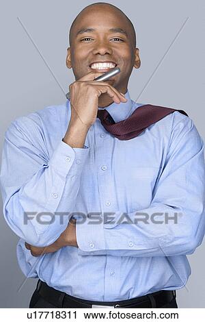 Portrait of mid adult businessman View Large Photo Image Stock Image - Portrait of mid adult businessman. Fotosearch