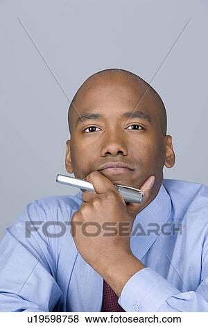 Stock Photo - Portrait of mid adult businessman. Fotosearch