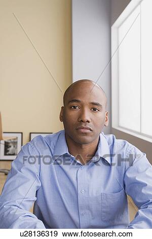 Stock Photo - Portrait of mid adult businessman. Fotosearch