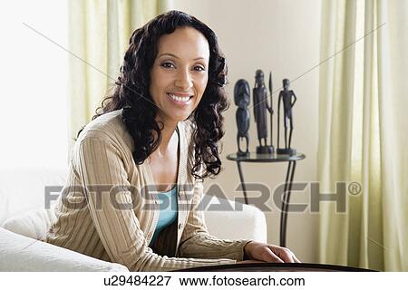 Portrait of mid adult woman at home View Large Photo Image Stock Photo - Portrait of mid adult woman at home. Fotosearch
