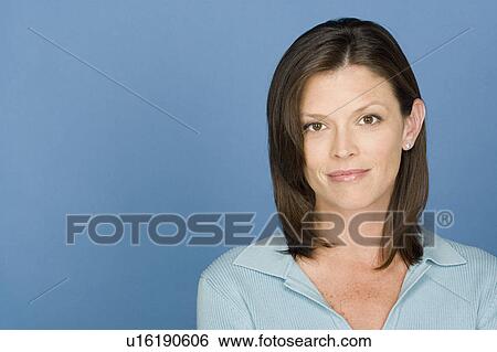 Stock Photograph - Portrait of mid adult woman. Fotosearch