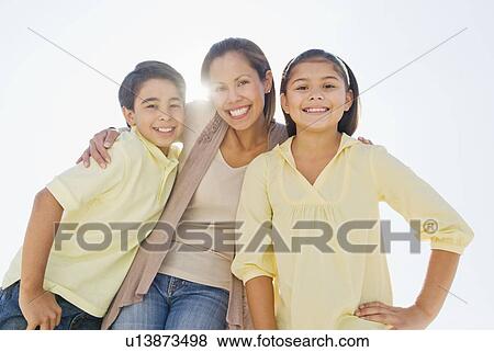Portrait of mother with son (12-13) and daughter (10-11) View Large Photo Image Stock Photo - Portrait of mother with son (12-13) and daughter (10-11). Fotosearch