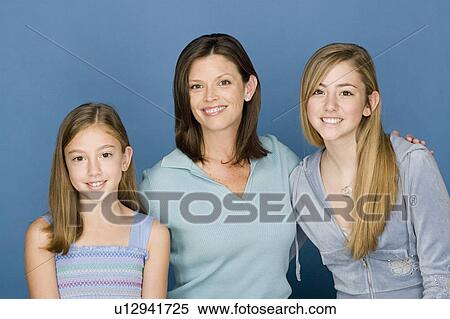Portrait of mother with two daughters (8-9, 14-15) View Large Photo Image Stock Photography - Portrait of mother with two daughters (8-9, 14-15). Fotosearch