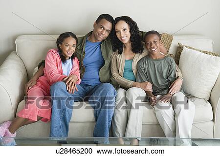 Stock Image - Portrait of parents with children (10-13). Fotosearch