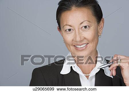 Portrait of portrait of happy mature businesswoman View Large Photo Image Stock Photo - Portrait of portrait of happy mature businesswoman. Fotosearch