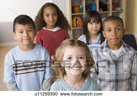 Stock Image - Portrait of schoolchildren (6-7). Fotosearch