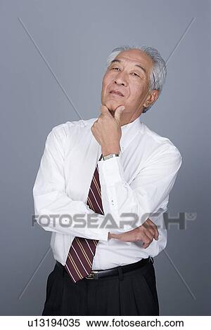 Stock Photography - Portrait of senior businessman. Fotosearch