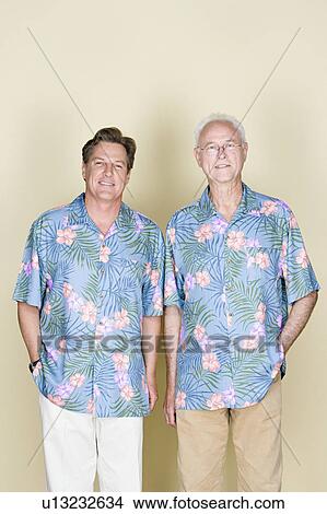 Portrait of senior man with adult son wearing Hawaiian shirts View Large Photo Image Picture - Portrait of senior man with adult son wearing Hawaiian shirts. Fotosearch