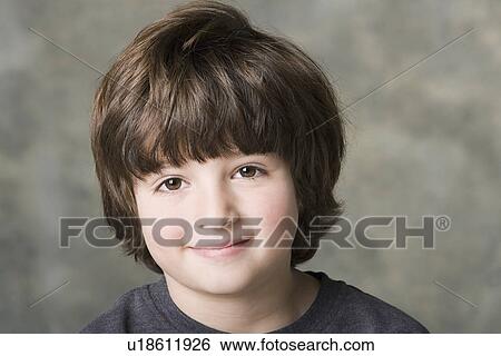 Portrait of smiling (6-7) boy, studio shot View Large Photo Image Stock Photograph - Portrait of smiling (6-7) boy, studio shot. Fotosearch