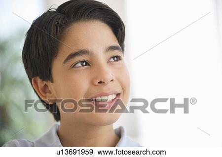 Stock Photo - Portrait of smiling boy (12-13). Fotosearch