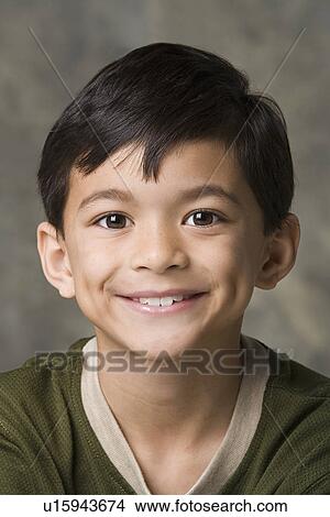 Picture - Portrait of smiling boy (8-9), studio shot. Fotosearch