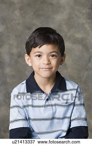 Portrait of smiling boy (8-9), studio shot View Large Photo Image Stock Photo - Portrait of smiling boy (8-9), studio shot. Fotosearch