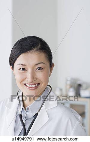 Portrait of smiling female doctor View Large Photo Image Stock Image - Portrait of smiling female doctor. Fotosearch
