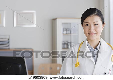 Portrait of smiling female doctor View Large Photo Image Stock Photo - Portrait of smiling female doctor. Fotosearch