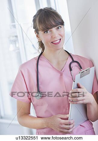 Portrait of smiling female nurse View Large Photo Image Stock Image - Portrait of smiling female nurse. Fotosearch