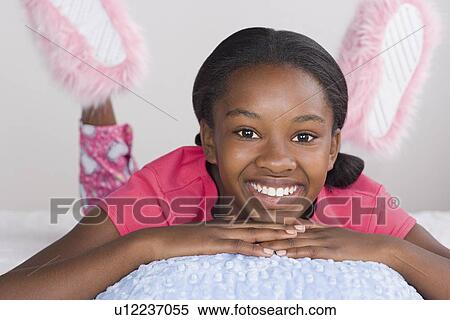 Portrait of smiling girl (10-11) in pajamas View Large Photo Image Stock Photography - Portrait of smiling girl (10-11) in pajamas. Fotosearch