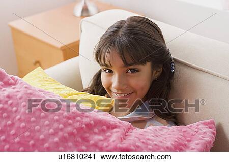 Portrait of smiling girl (10-11) with pillows View Large Photo Image Stock Image - Portrait of smiling girl (10-11) with pillows. Fotosearch