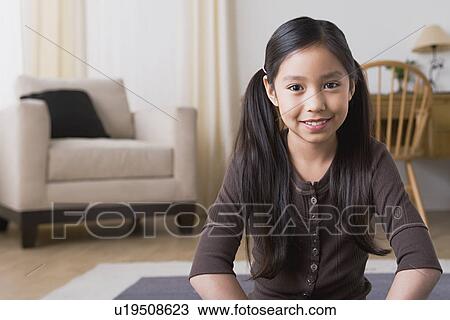 Stock Image - Portrait of smiling girl (8-9). Fotosearch