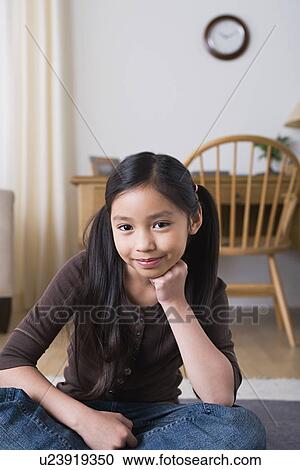 Stock Image - Portrait of smiling girl (8-9). Fotosearch