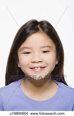 Portrait of smiling girl (8-9), studio shot View Large Photo Image Picture - Portrait of smiling girl (8-9), studio shot. Fotosearch