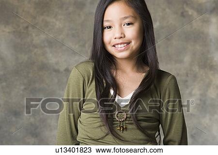 Portrait of smiling girl (8-9), studio shot View Large Photo Image Stock Image - Portrait of smiling girl (8-9), studio shot. Fotosearch