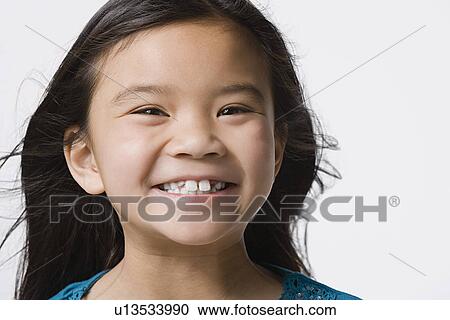 Portrait of smiling girl (8-9), studio shot View Large Photo Image Stock Image - Portrait of smiling girl (8-9), studio shot. Fotosearch