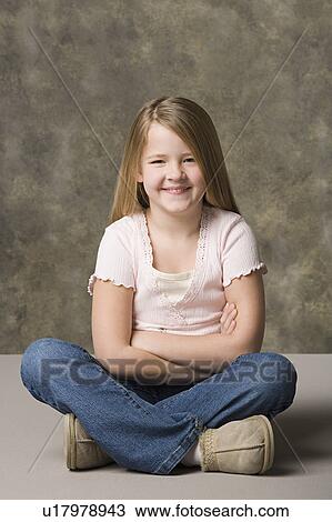 Portrait of smiling girl (8-9), studio shot View Large Photo Image Stock Image - Portrait of smiling girl (8-9), studio shot. Fotosearch
