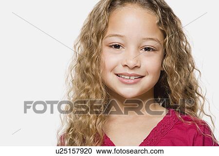 Portrait of smiling girl (8-9), studio shot View Large Photo Image Stock Image - Portrait of smiling girl (8-9), studio shot. Fotosearch