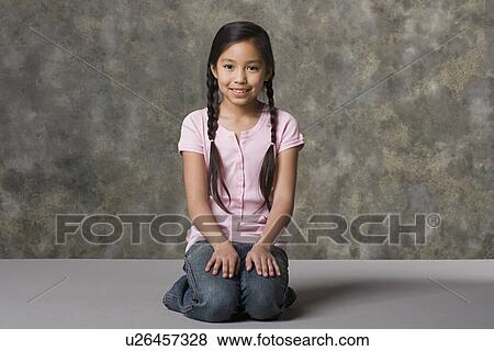 Portrait of smiling girl (8-9), studio shot View Large Photo Image Stock Photo - Portrait of smiling girl (8-9), studio shot. Fotosearch