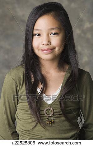 Portrait of smiling girl (8-9), studio shot View Large Photo Image Stock Photograph - Portrait of smiling girl (8-9), studio shot. Fotosearch