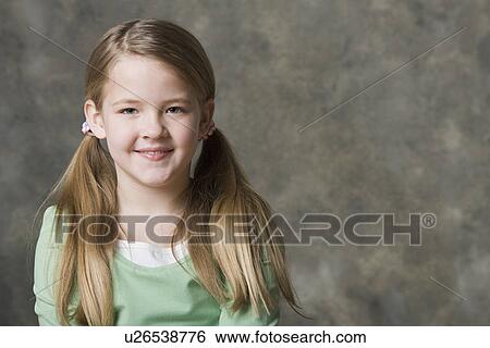 Portrait of smiling girl (8-9), studio shot View Large Photo Image Stock Photograph - Portrait of smiling girl (8-9), studio shot. Fotosearch