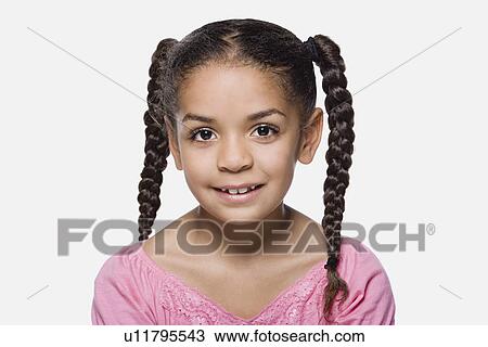 Portrait of smiling girl (8-9) with braids, studio shot View Large Photo Image Stock Image - Portrait of smiling girl (8-9) with braids, studio shot. Fotosearch