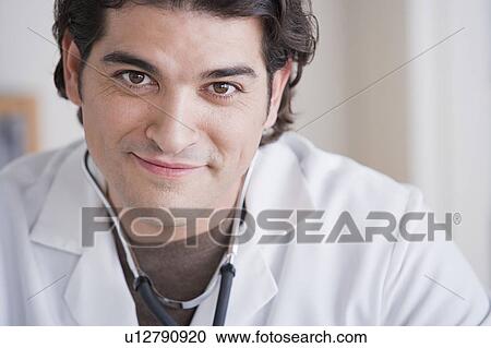 Stock Image - Portrait of smiling male doctor. Fotosearch