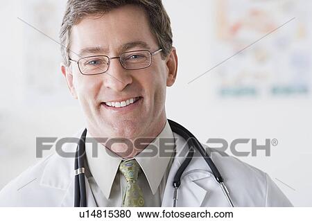 Stock Image - Portrait of smiling male doctor. Fotosearch