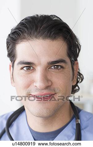 Portrait of smiling male doctor View Large Photo Image Stock Photo - Portrait of smiling male doctor. Fotosearch