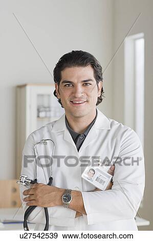 Portrait of smiling male doctor View Large Photo Image Stock Photo - Portrait of smiling male doctor. Fotosearch