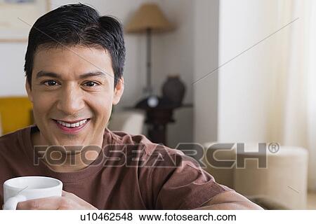 Portrait of smiling man with cup View Large Photo Image Stock Photo - Portrait of smiling man with cup. Fotosearch