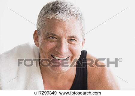 Stock Photo - Portrait of smiling mature man in gym. Fotosearch